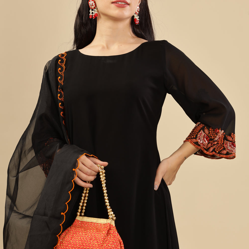 
                      
                        Black Premium embellished Burnt Orange kurta set
                      
                    